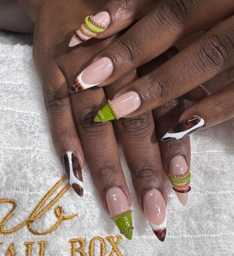 Hand-painted red nail art set with detailed line work